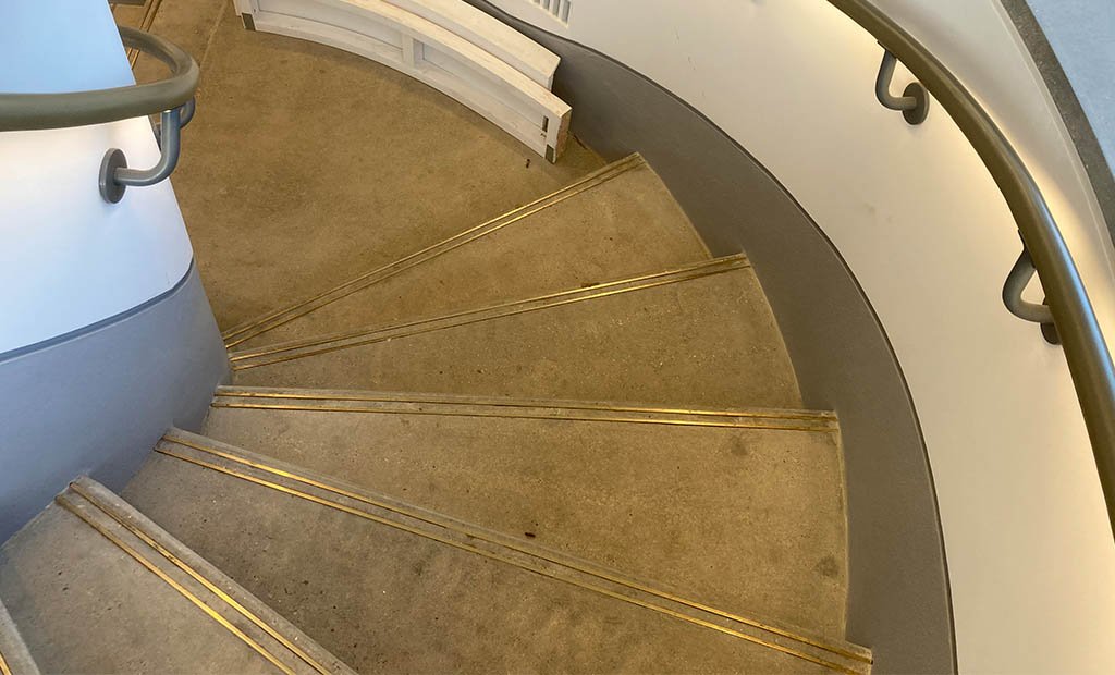 Polished-Precast-Concrete-Curved-Stair-treads-with-brass-strips-01.jpg