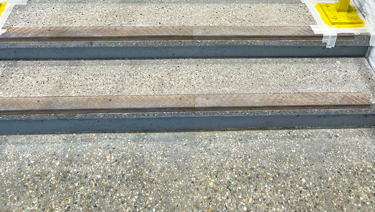 Visual precast steps to honed exposed aggregate finish with AATI brass nosing grip strip