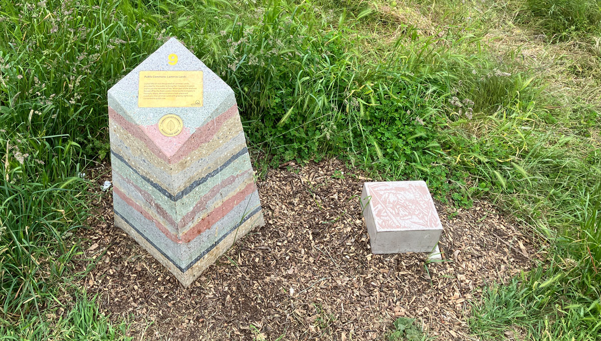 multi layered visual precast concrete way marker on wilderness path