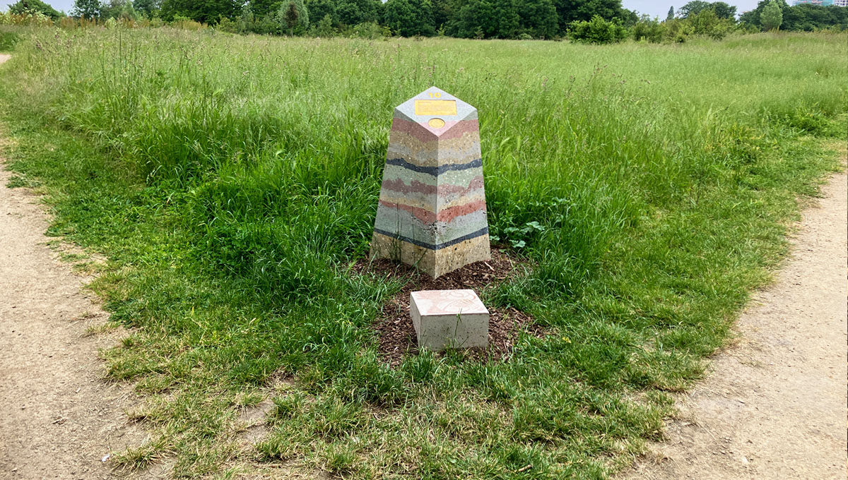 multi layered visual precast concrete way marker on wilderness path