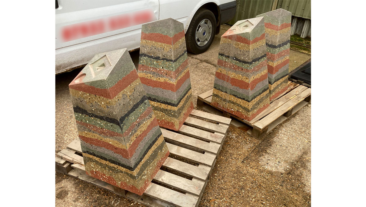 multi layered visual precast concrete way marker on pallets after being washed