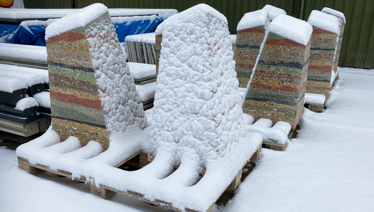 multi layered visual precast concrete way marker on pallets in the snow