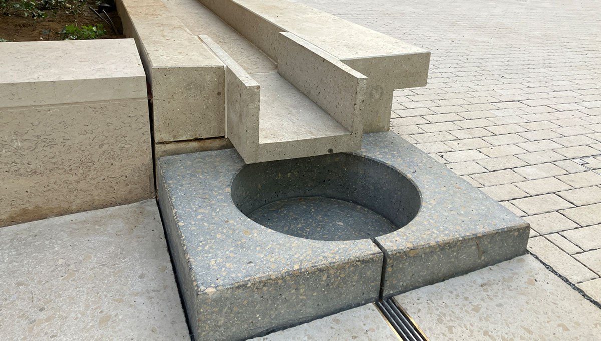Drainage rill feeding a basin at the Natural History Museum, London with the Vico Visual Concrete drainage rill running down both sides
